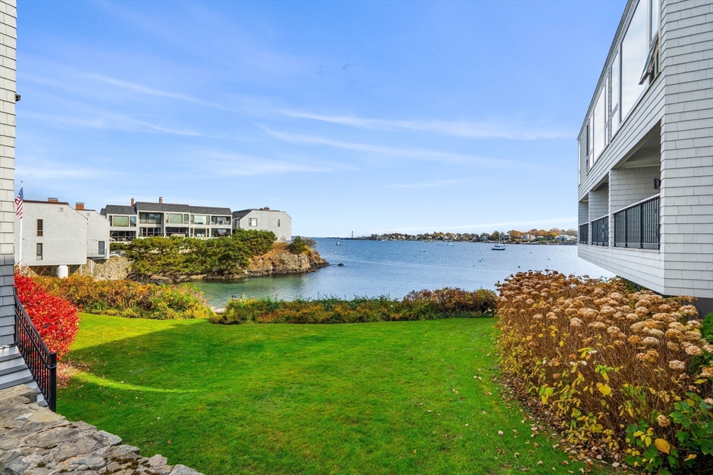 55 Brackett Place, Unit D Marblehead, MA 01945 - Photo 27 of 34 a aerial view of a house with a garden and lake view