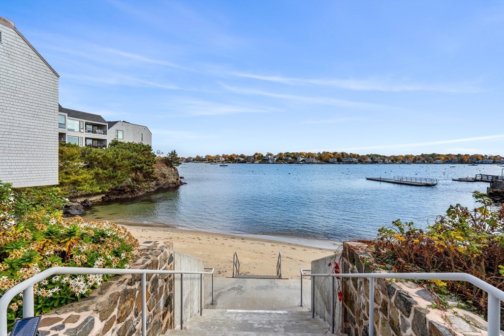 55 Brackett Place, Unit D Marblehead, MA 01945 - Photo 29 of 34 a view of a lake with a terrace