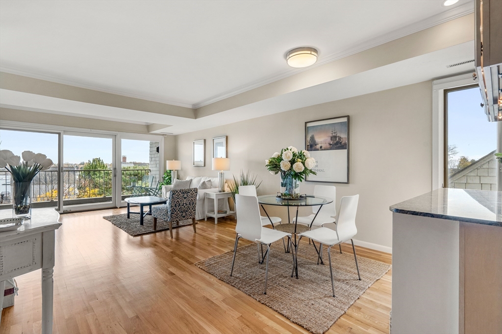 55 Brackett Place, Unit D Marblehead, MA 01945 - Photo 5 of 34 a living room with furniture and a large window
