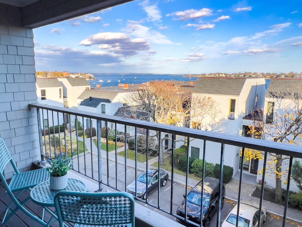 55 Brackett Place, Unit D Marblehead, MA 01945 - Photo 7 of 34 a view of a balcony with chair and city view