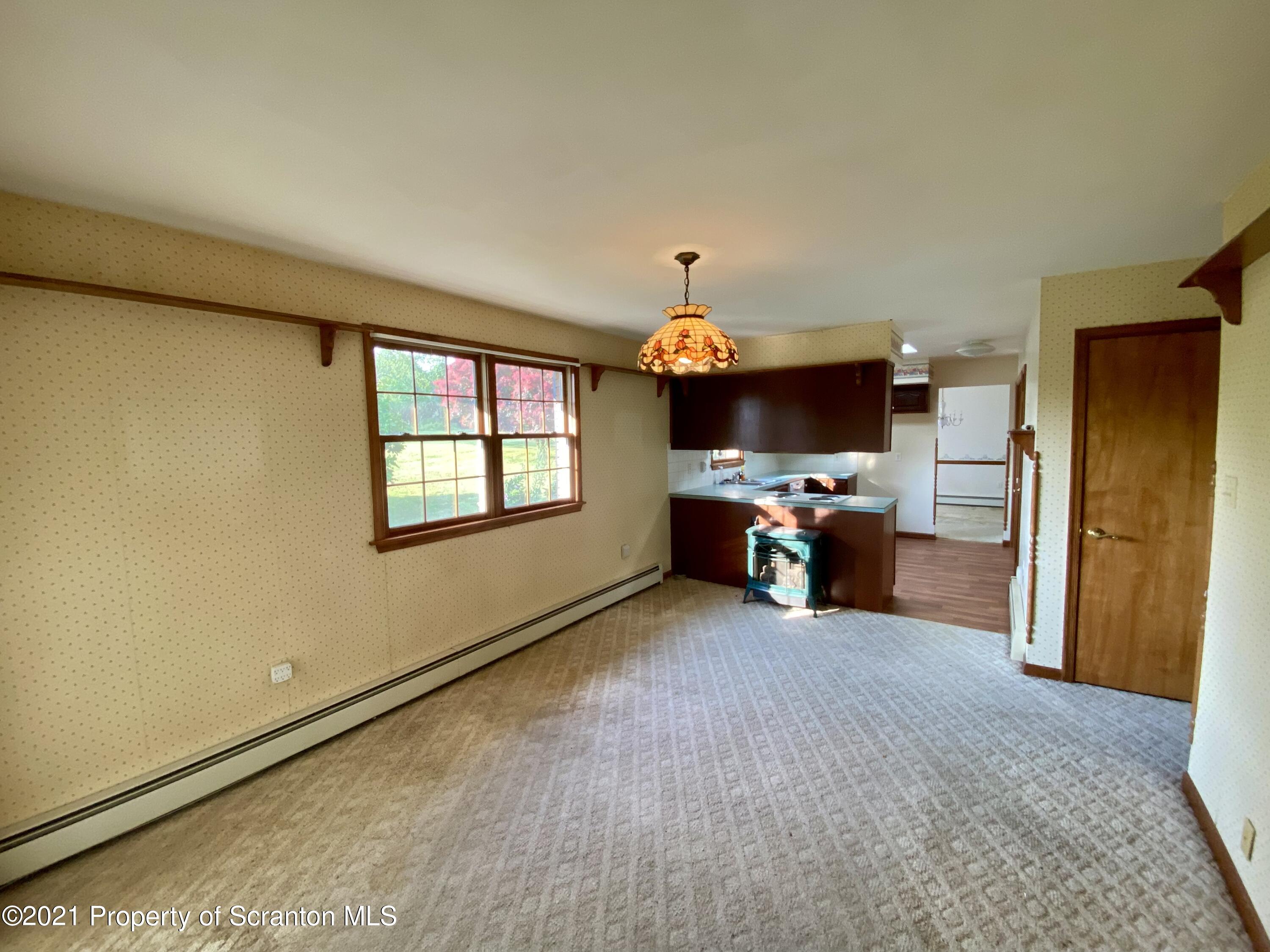64 Thistle Hill Road Nicholson, PA 18446 - Photo 15 of 47 a view of a livingroom with a flat screen tv