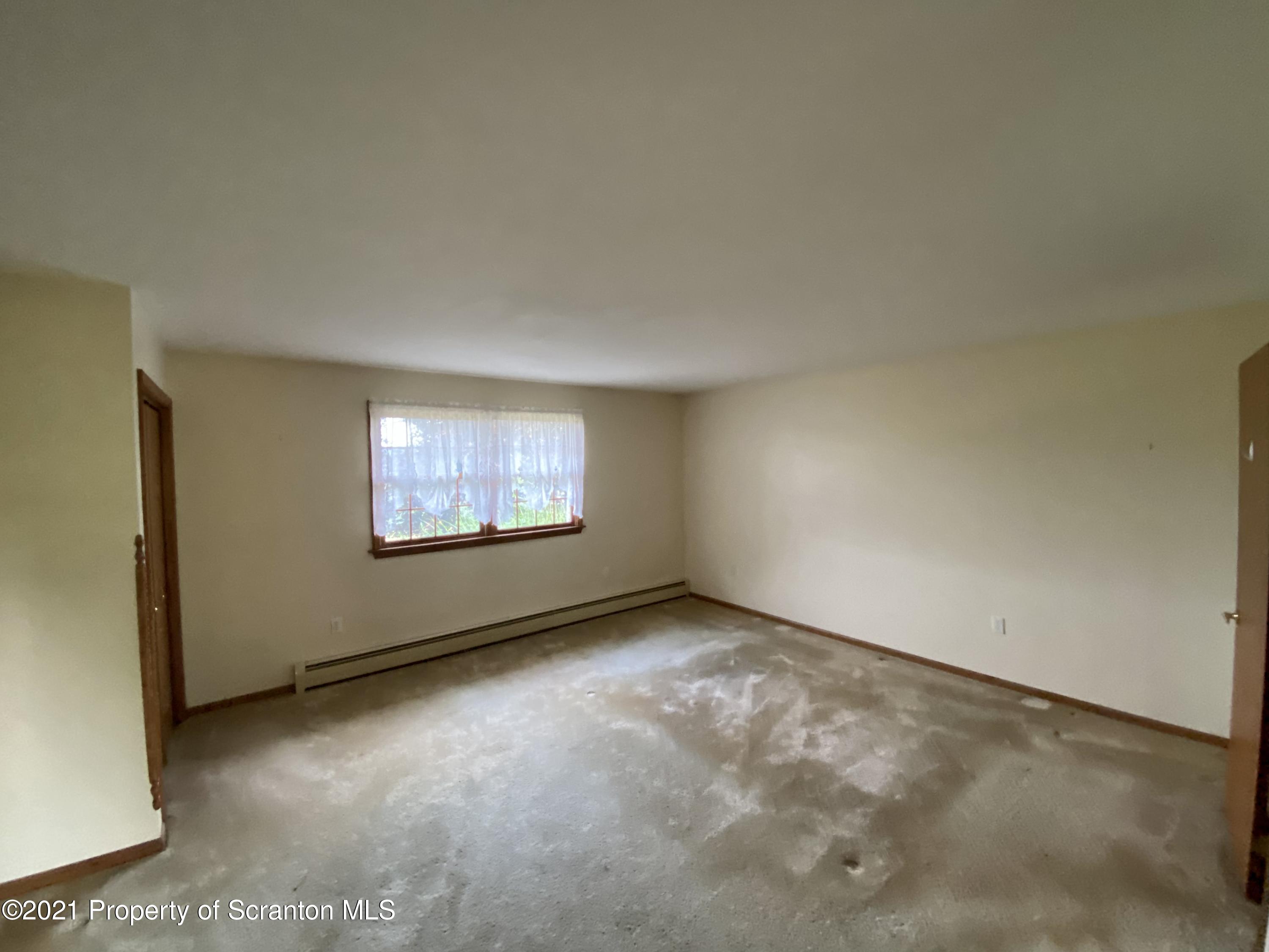 64 Thistle Hill Road Nicholson, PA 18446 - Photo 17 of 47 an empty room with windows