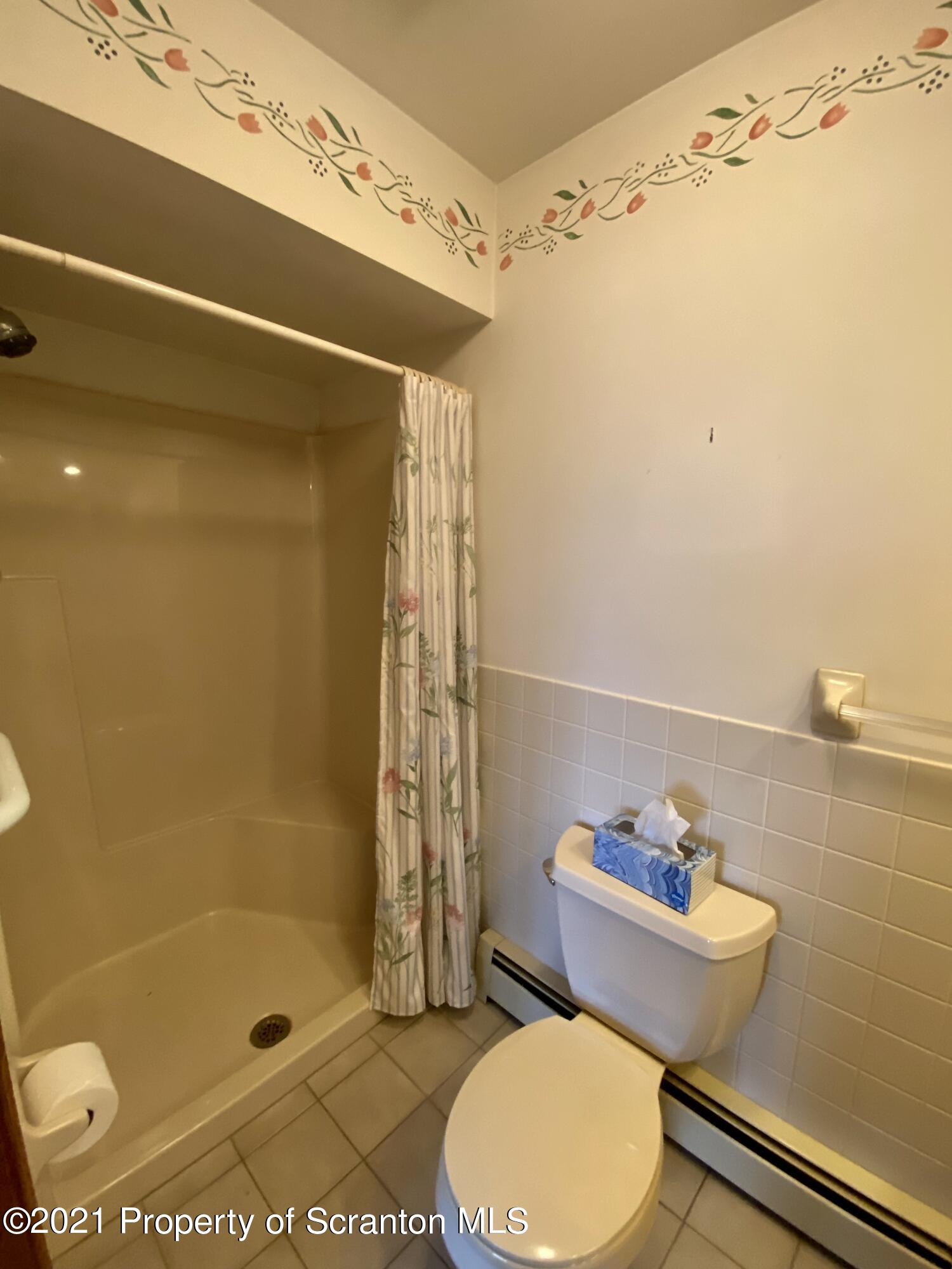 64 Thistle Hill Road Nicholson, PA 18446 - Photo 19 of 47 a bathroom with a sink and a mirror