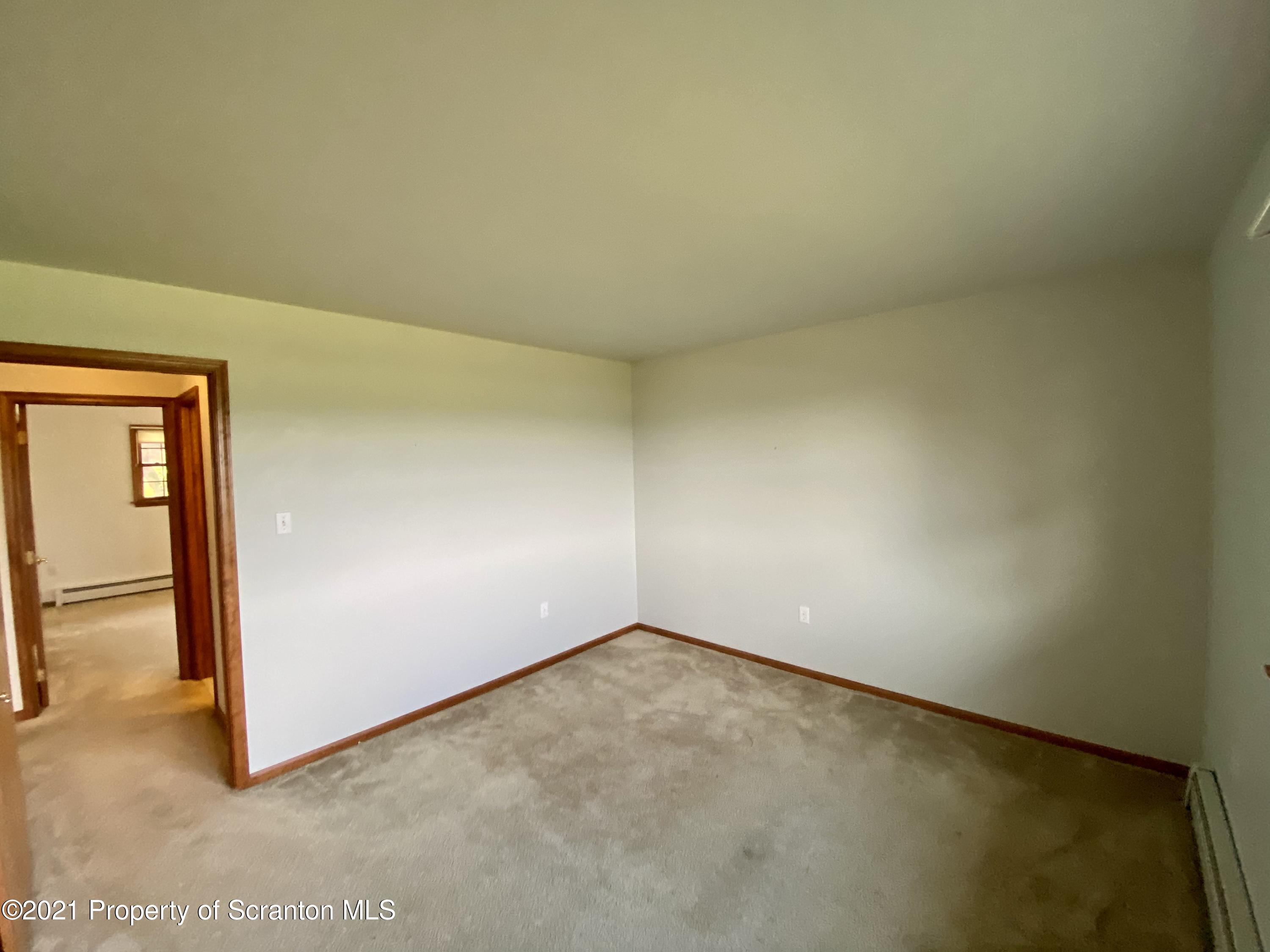 64 Thistle Hill Road Nicholson, PA 18446 - Photo 22 of 47 an empty room with a bench
