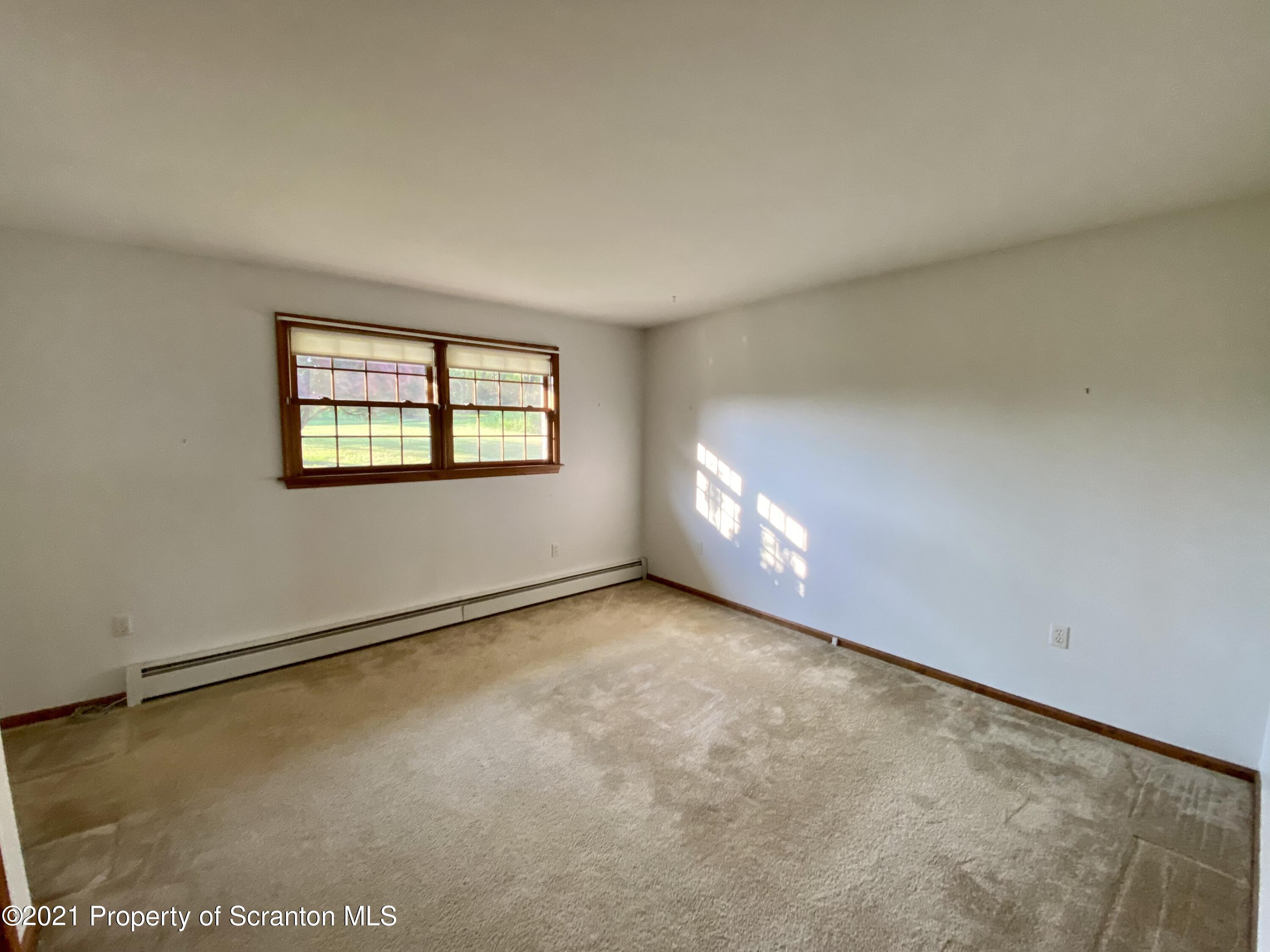 64 Thistle Hill Road Nicholson, PA 18446 - Photo 23 of 47 an empty room with windows