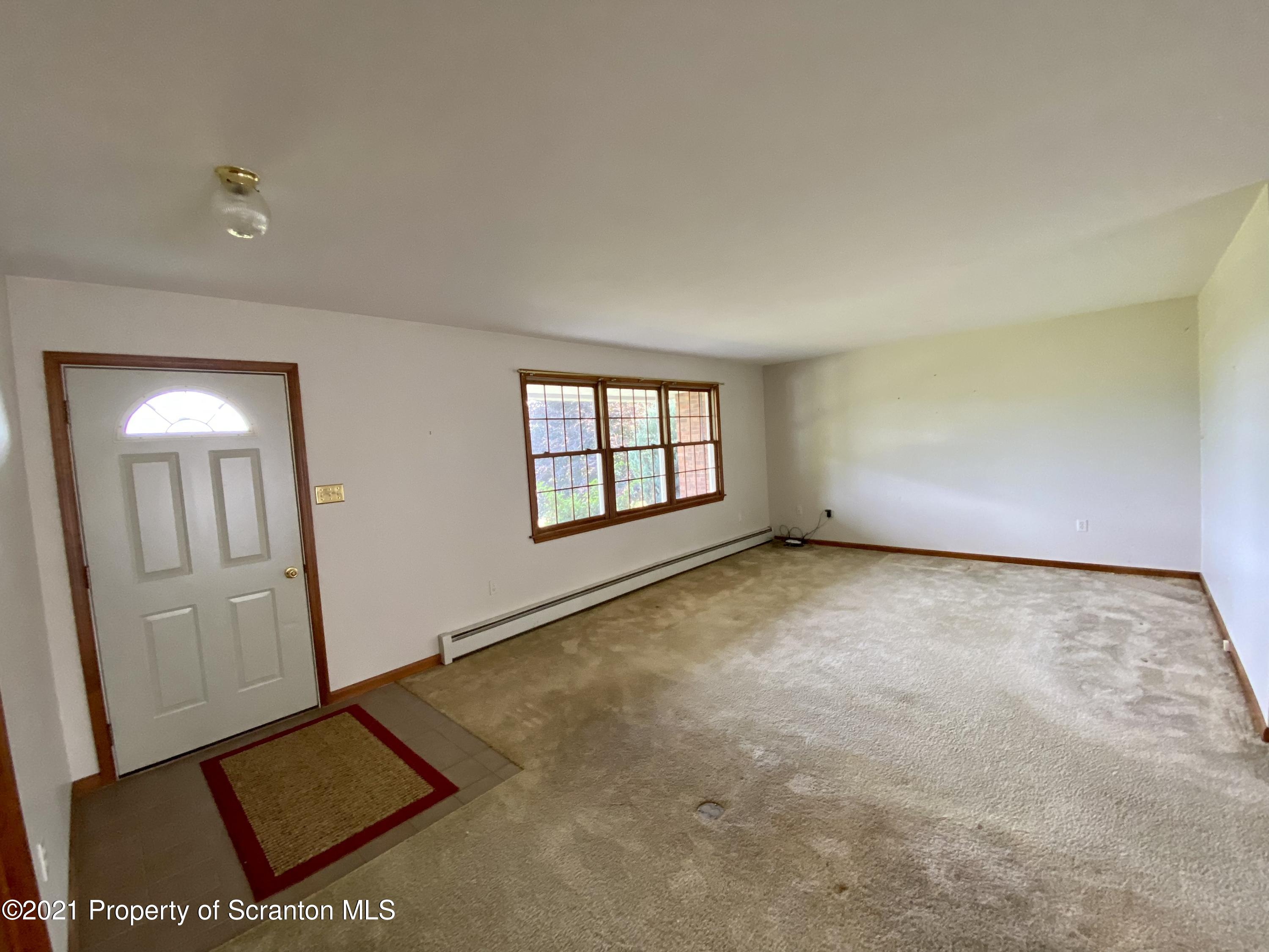 64 Thistle Hill Road Nicholson, PA 18446 - Photo 10 of 47 an empty room with windows
