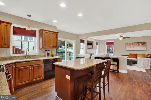 a kitchen with granite countertop a sink and center island