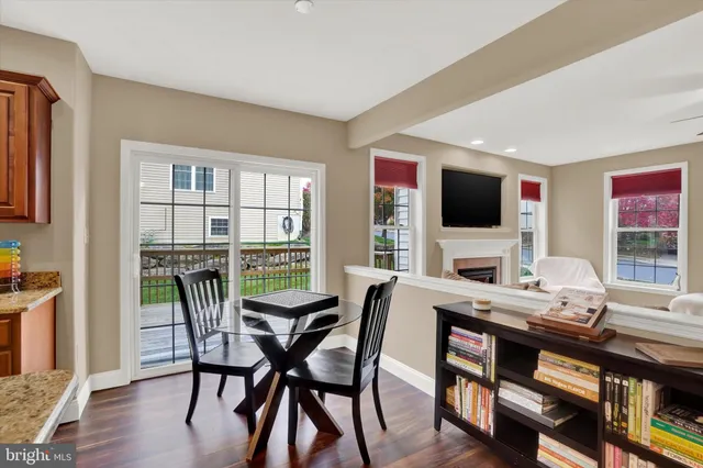 a view of a workspace with furniture window and wooden floor