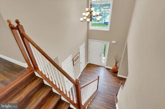 a view of an entryway with wooden floor