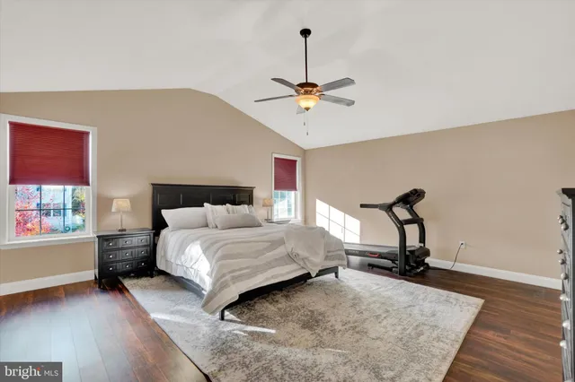 a bedroom with a bed window and a table