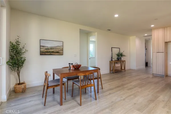 a bathroom with a glass shower door and a sink