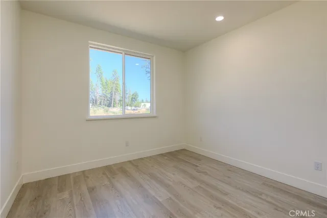 a white toilet sitting next to a bath tub