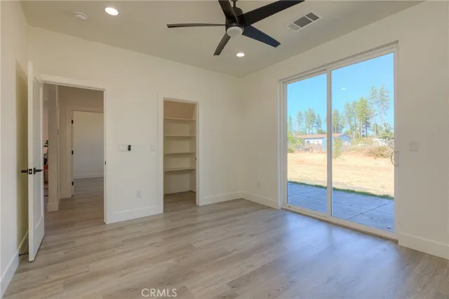 an aerial view of residential house with parking and city view