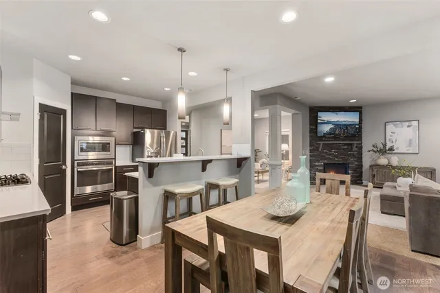 a kitchen with cabinets and refrigerator