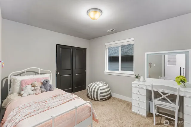 a bedroom with a bed and a table