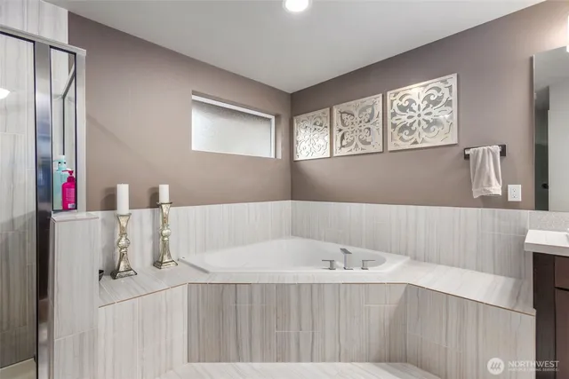 a bathroom with a bathtub and a sink