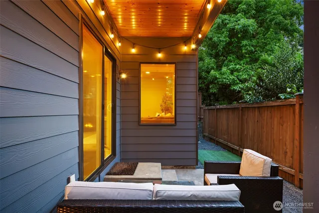 a view of house with patio furniture and entryway