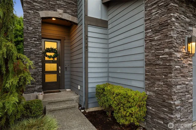 a view of a door and brick walls