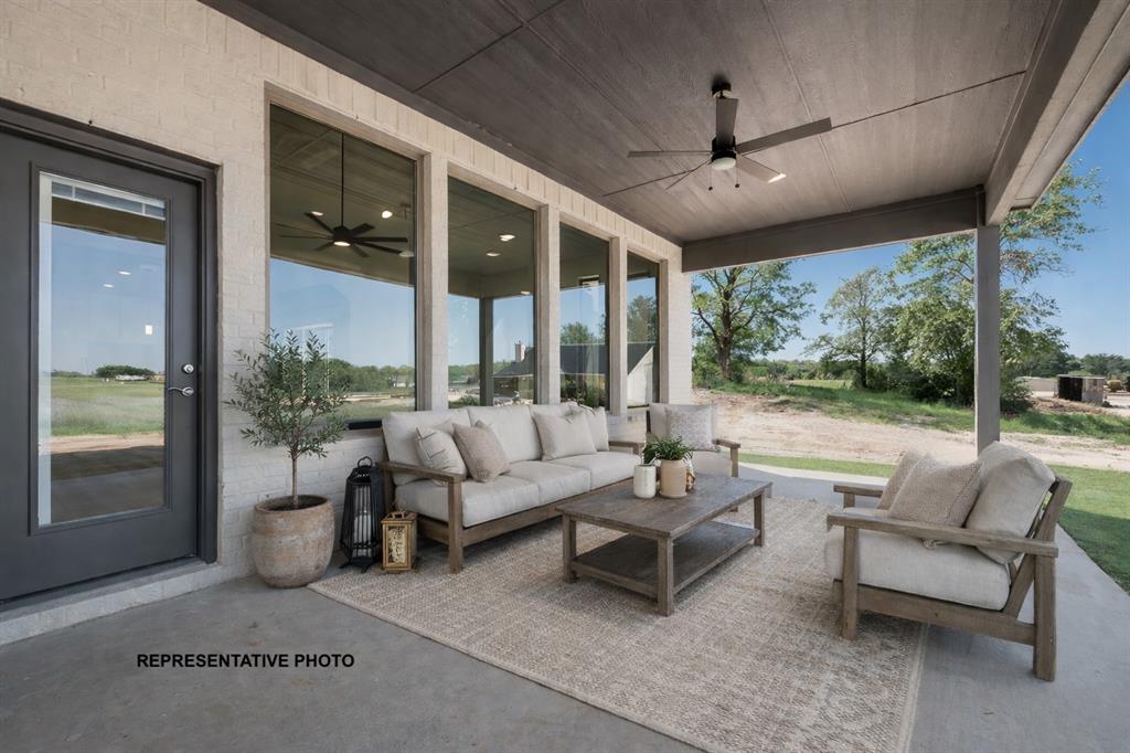 1036 Monaco Court Springtown, TX 76082 - Photo 11 of 12 a balcony with furniture and a garden