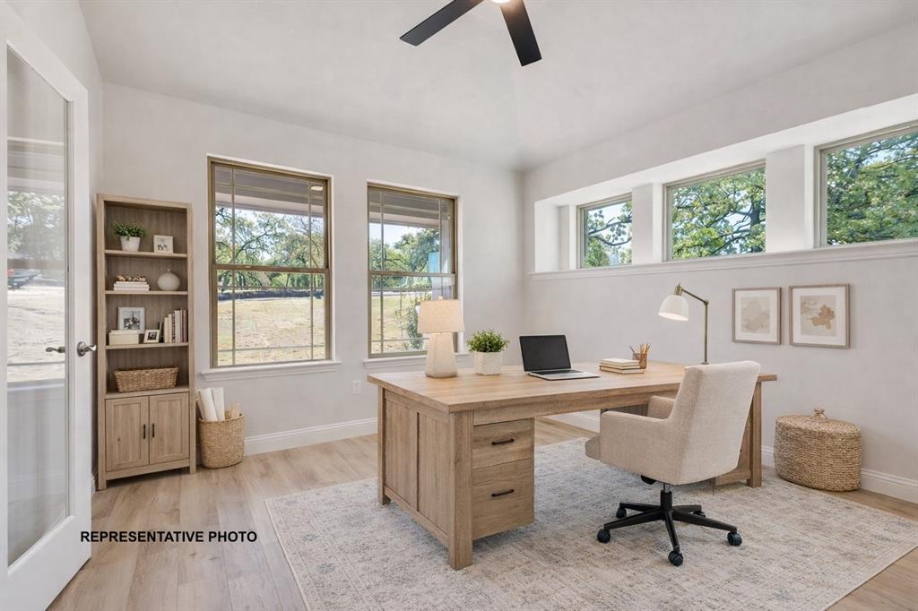 1036 Monaco Court Springtown, TX 76082 - Photo 3 of 12 a view of a workspace with furniture and a window