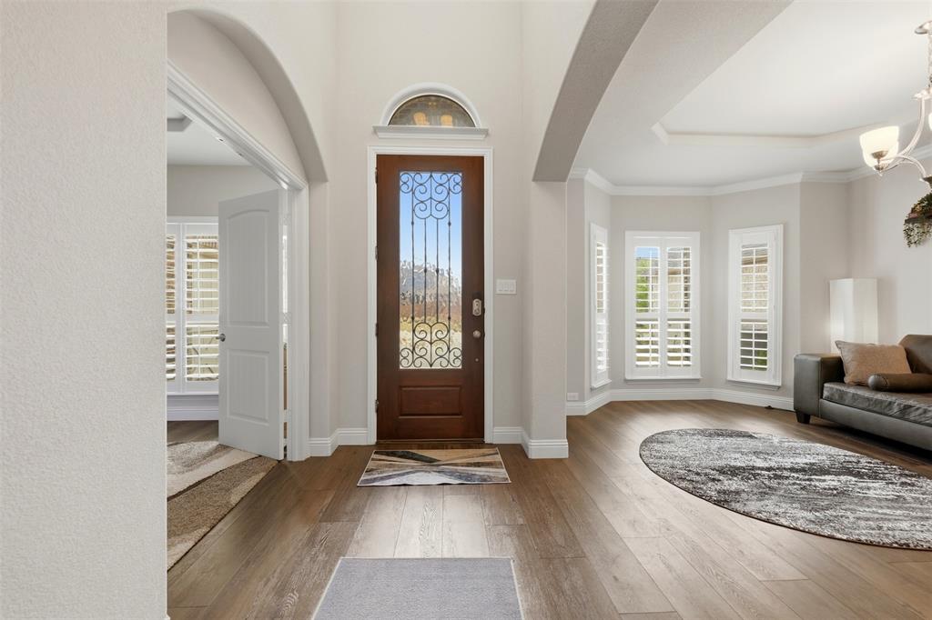418 Crestview Drive Midlothian, TX 76065 - Photo 4 of 39 Entryway featuring light wood-style floors and a chandelier
