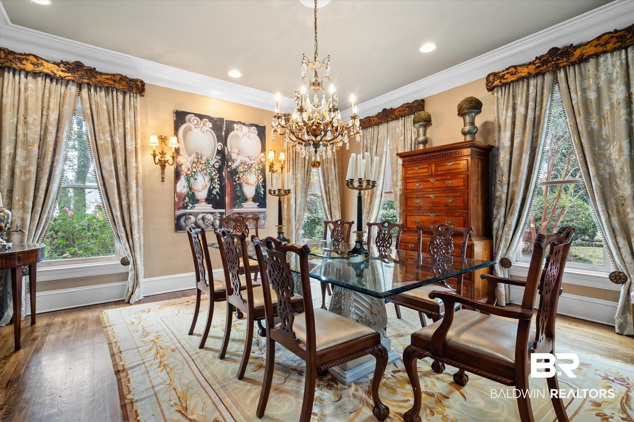354 Dogwood Lane Mobile, AL 36608 - Photo 3 of 44 Dining area featuring ornamental molding, an inviting chandelier, and light wood-type flooring