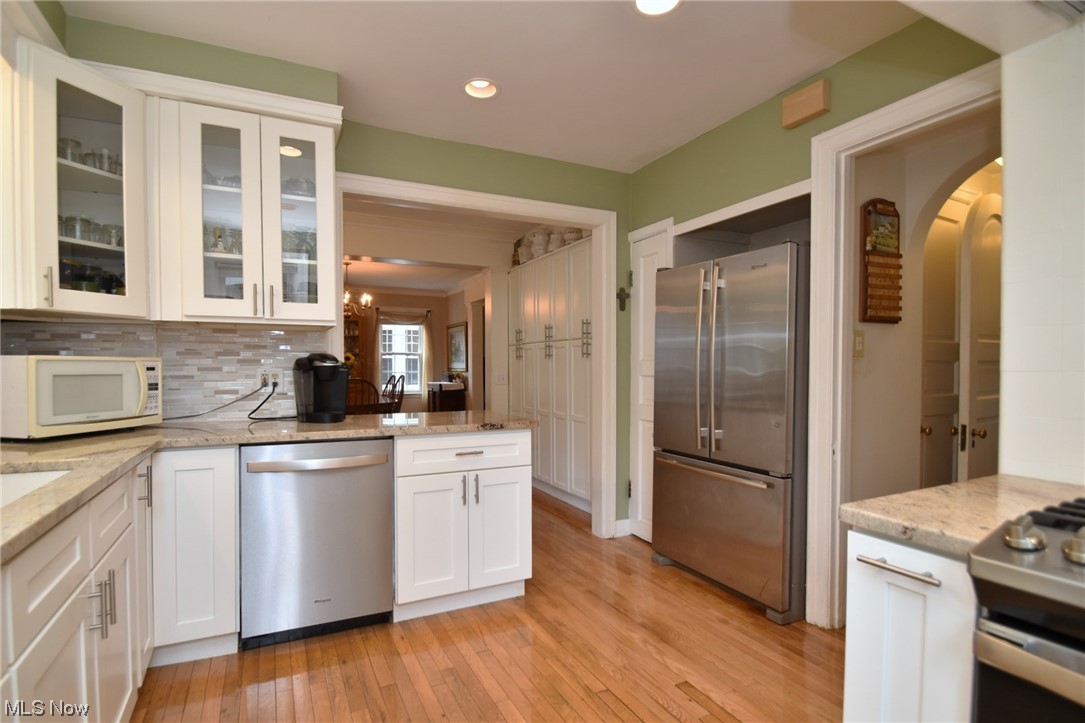 2447 Edgerton Road Cleveland, OH 44118 - Photo 11 of 34 Stainless appliances and peninsula overlooking dining room