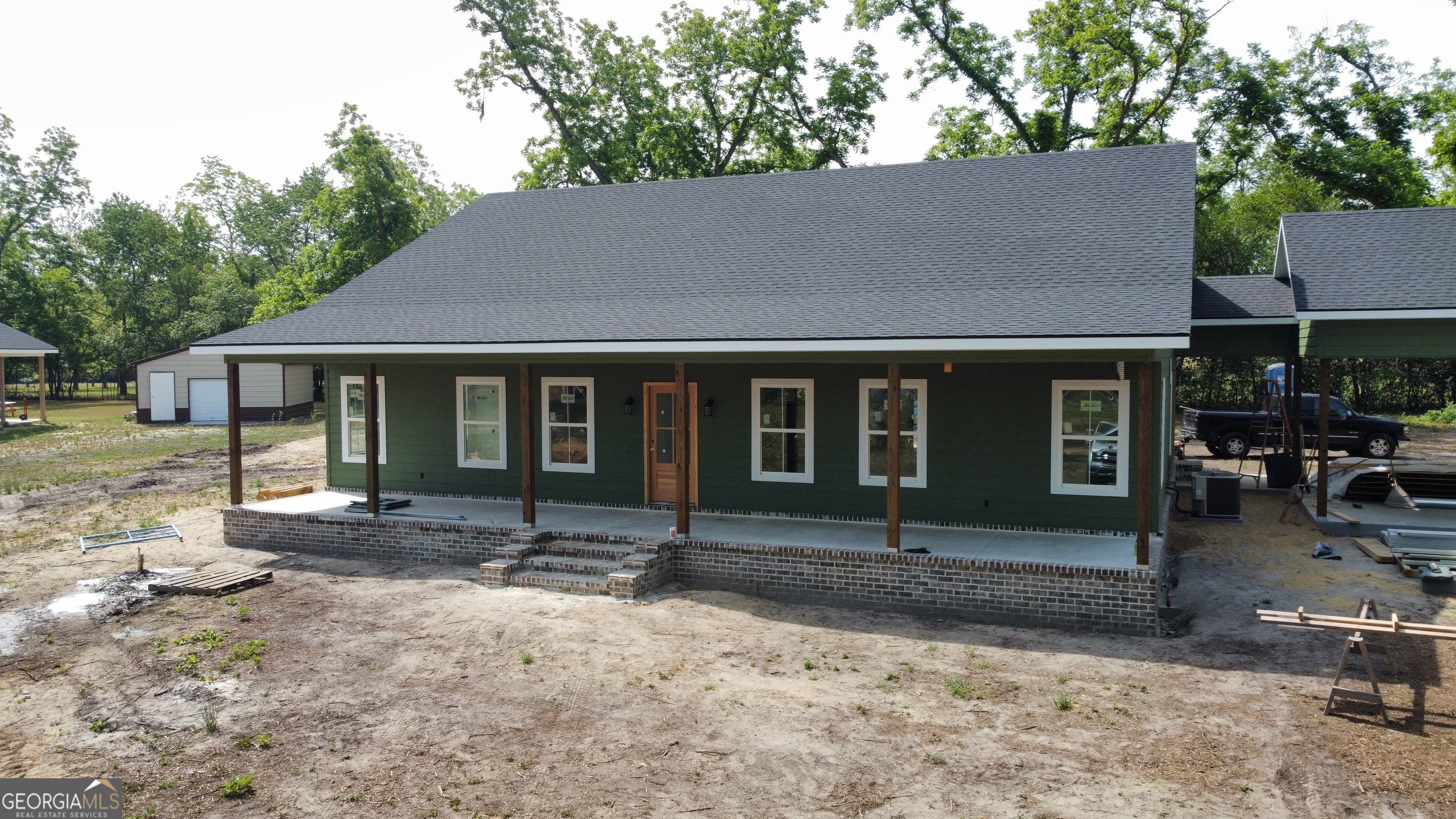 3411 Bob Bowen Road Blackshear, GA 31516 - Photo 1 of 13 a front view of a house with garden