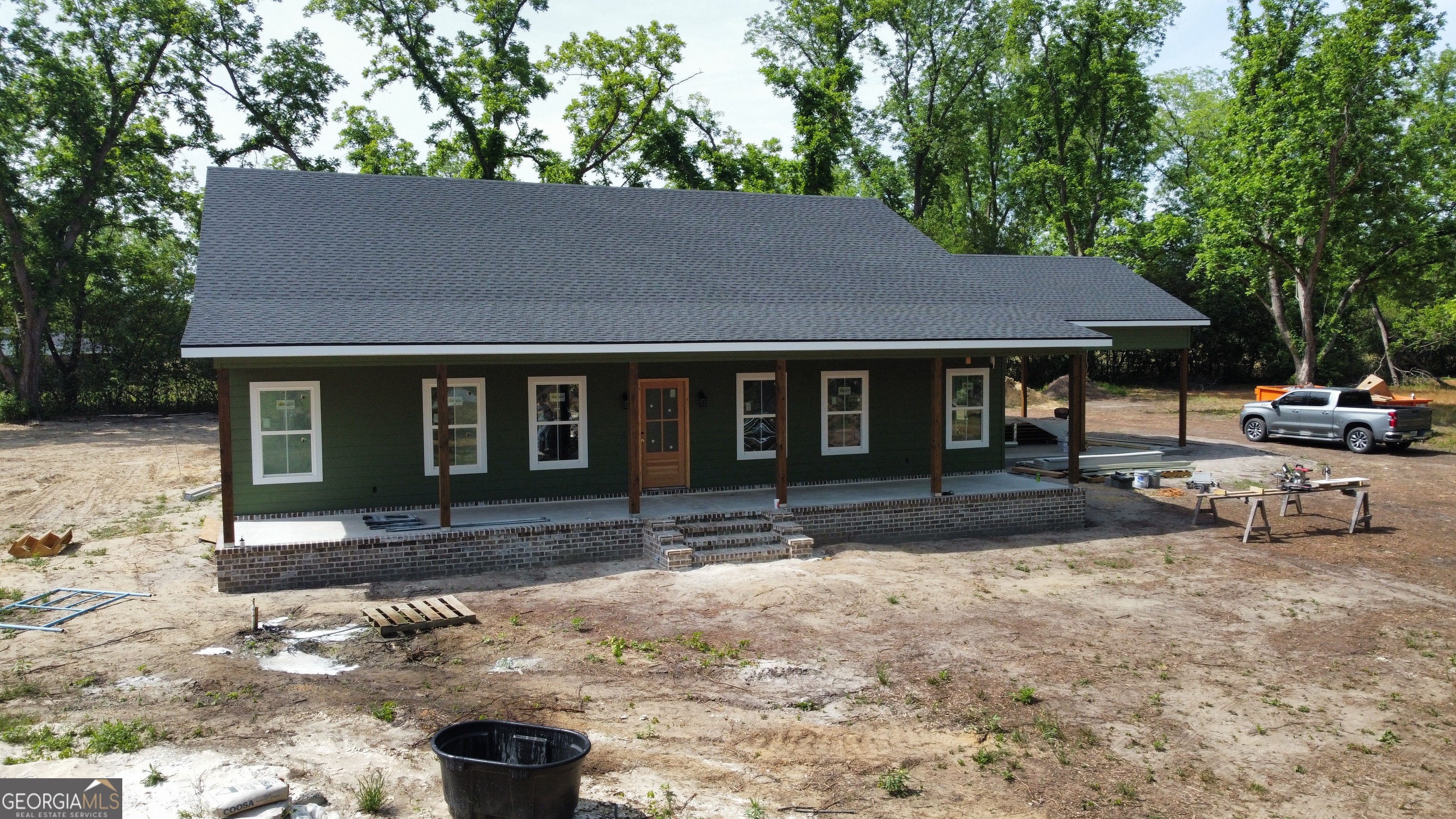 3411 Bob Bowen Road Blackshear, GA 31516 - Photo 11 of 13 a front view of a house with garden