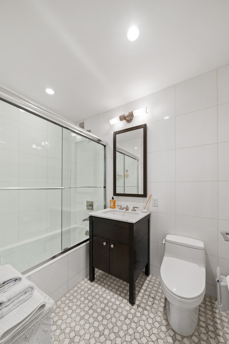 80 Riverside Boulevard, Unit 5S Manhattan, NY 10069 - Photo 10 of 24 a bathroom with a sink toilet and mirror