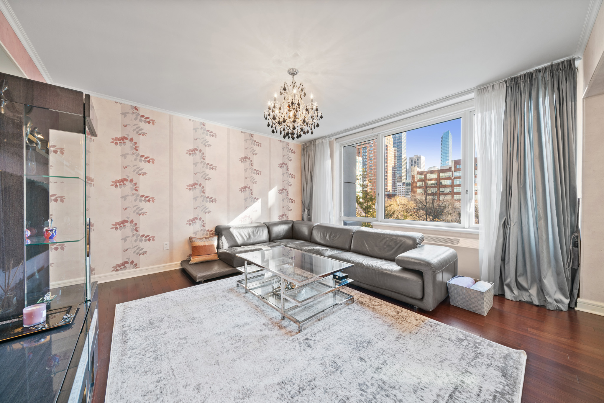 80 Riverside Boulevard, Unit 5S Manhattan, NY 10069 - Photo 3 of 24 a living room with furniture and a large window