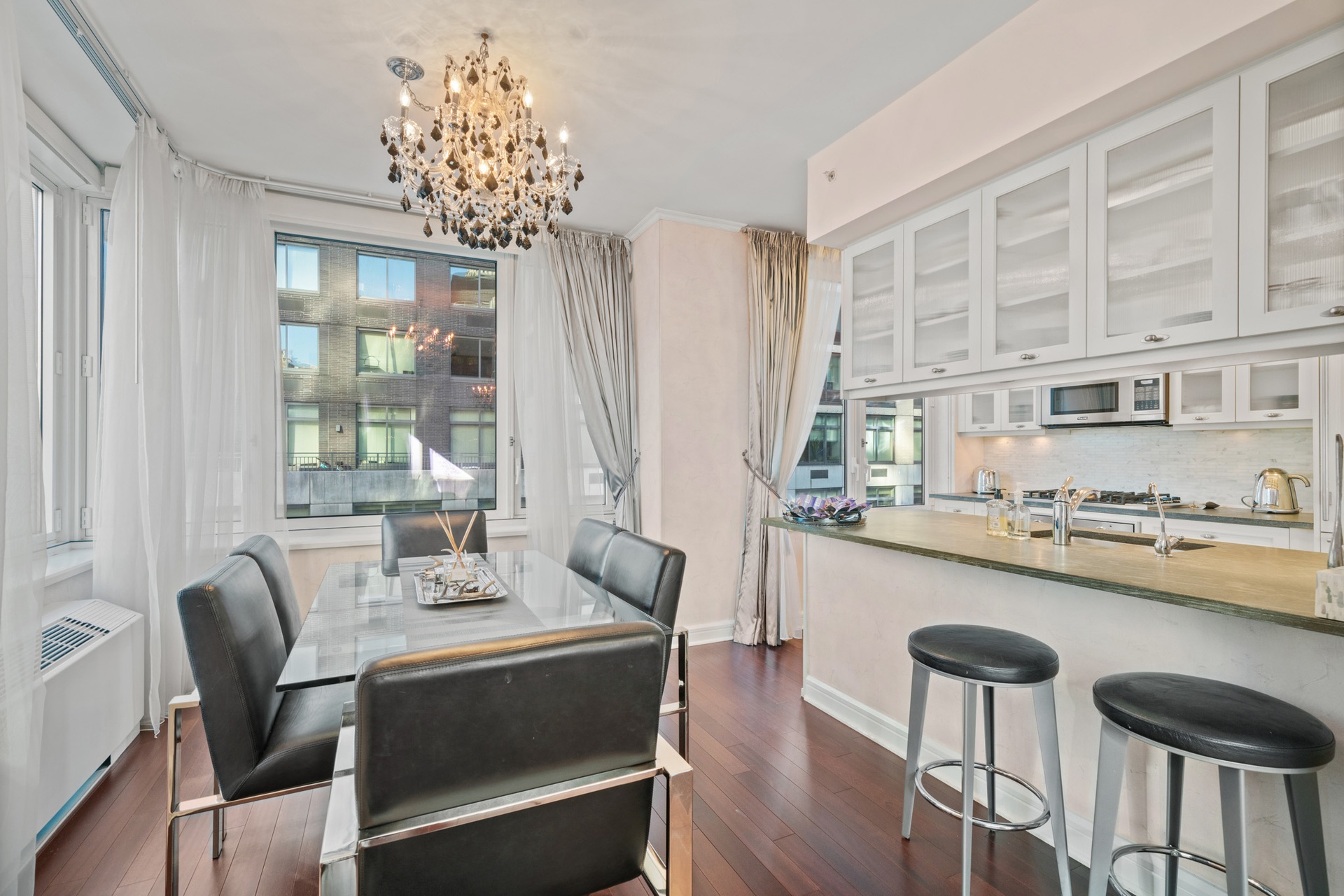 80 Riverside Boulevard, Unit 5S Manhattan, NY 10069 - Photo 4 of 24 a dining room with furniture and window