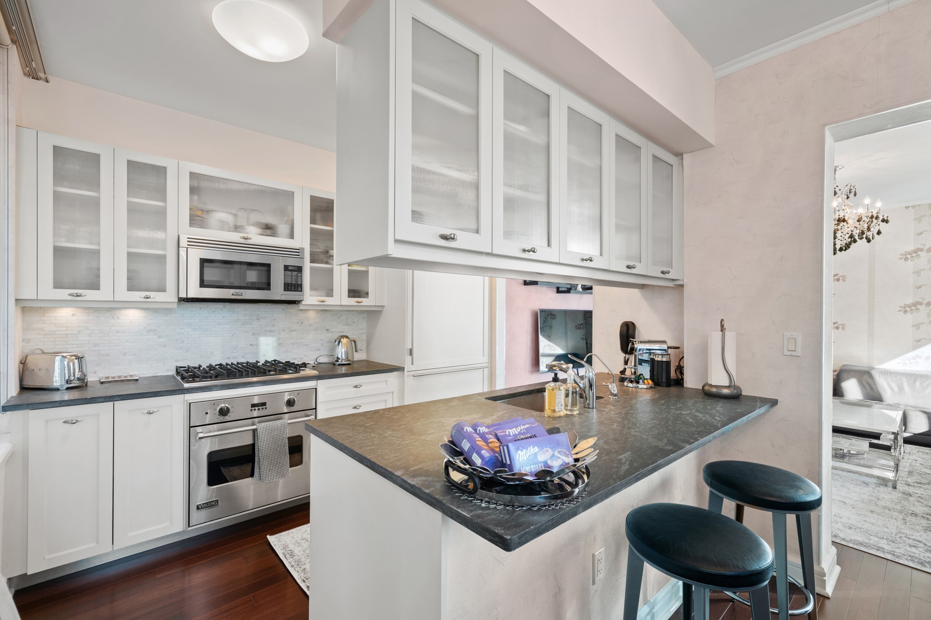 80 Riverside Boulevard, Unit 5S Manhattan, NY 10069 - Photo 5 of 24 a kitchen with stainless steel appliances a stove a sink and cabinets