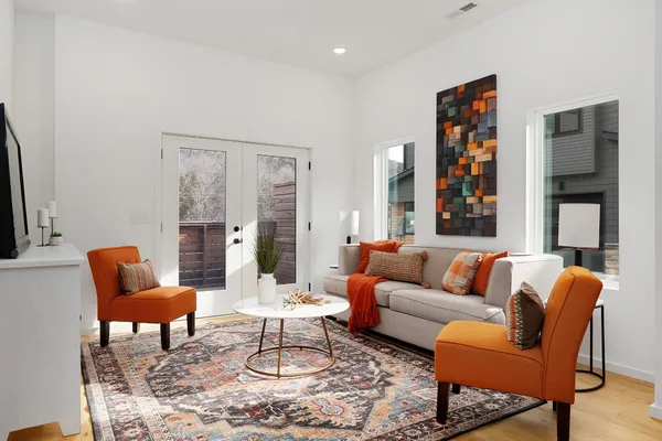 a living room with furniture and a large window