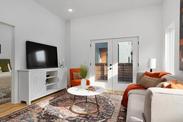 a living room with furniture and a flat screen tv