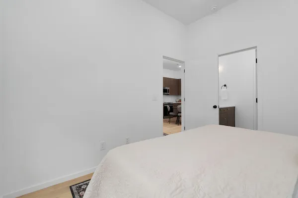 a large bed in a white room