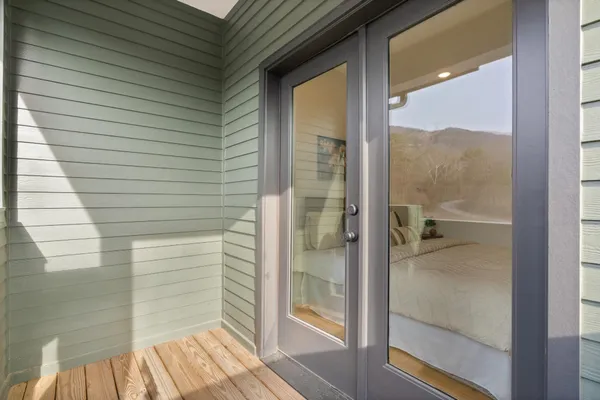 a view of a door and a window