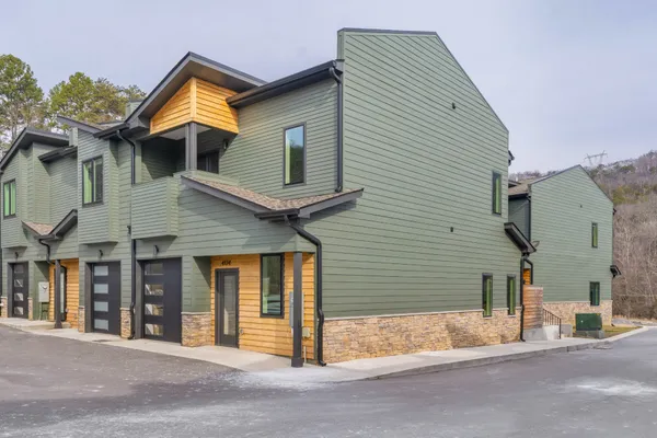a front view of a house with a garage