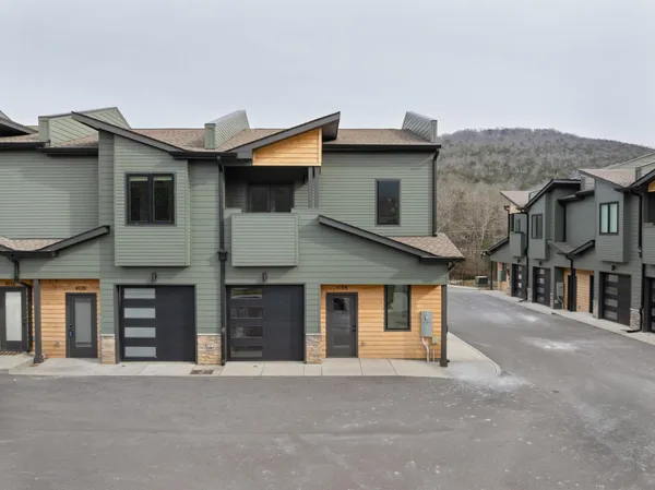 a front view of a house with a garage