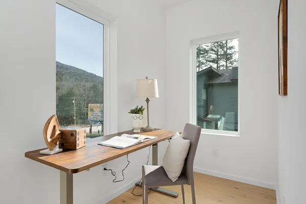 a dining room with furniture and window