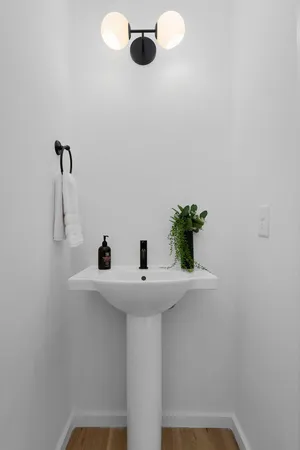 a bathroom with a sink and mirror