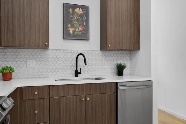 a kitchen with a sink and cabinets