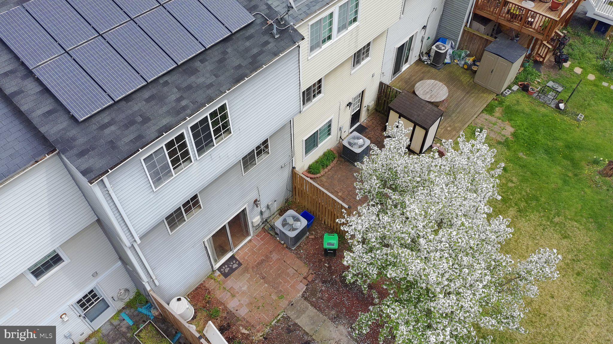17005 Moss Side Lane, Unit 43 Olney, MD 20832 - Photo 2 of 7 Charming backyard with solar panels.