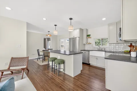 a kitchen with a sink and cabinets