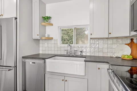 a kitchen that has a table chairs and wooden floor