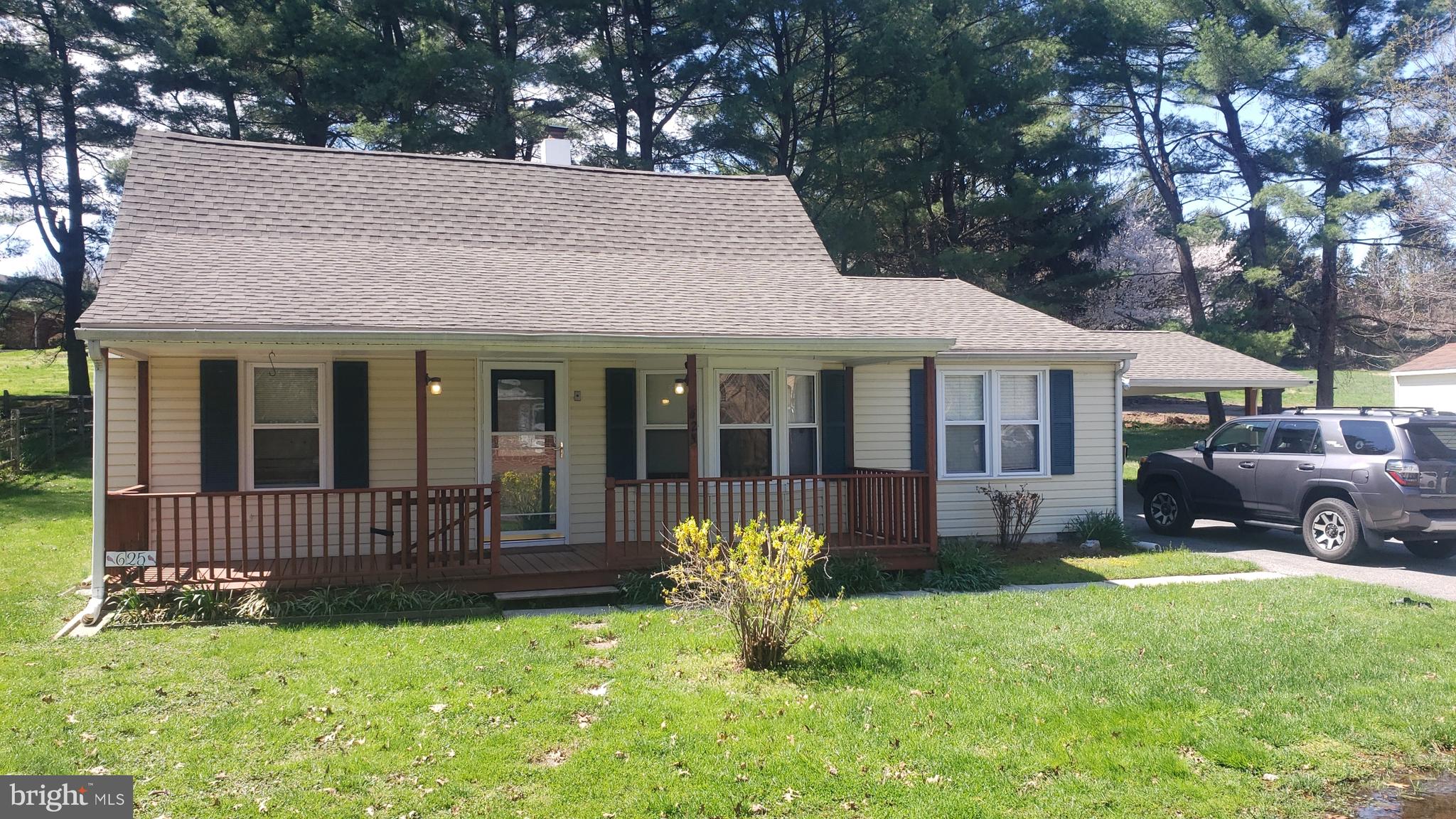 625 Southwood Road Hockessin, DE 19707 - Photo 1 of 16 a front view of a house with a garden and porch