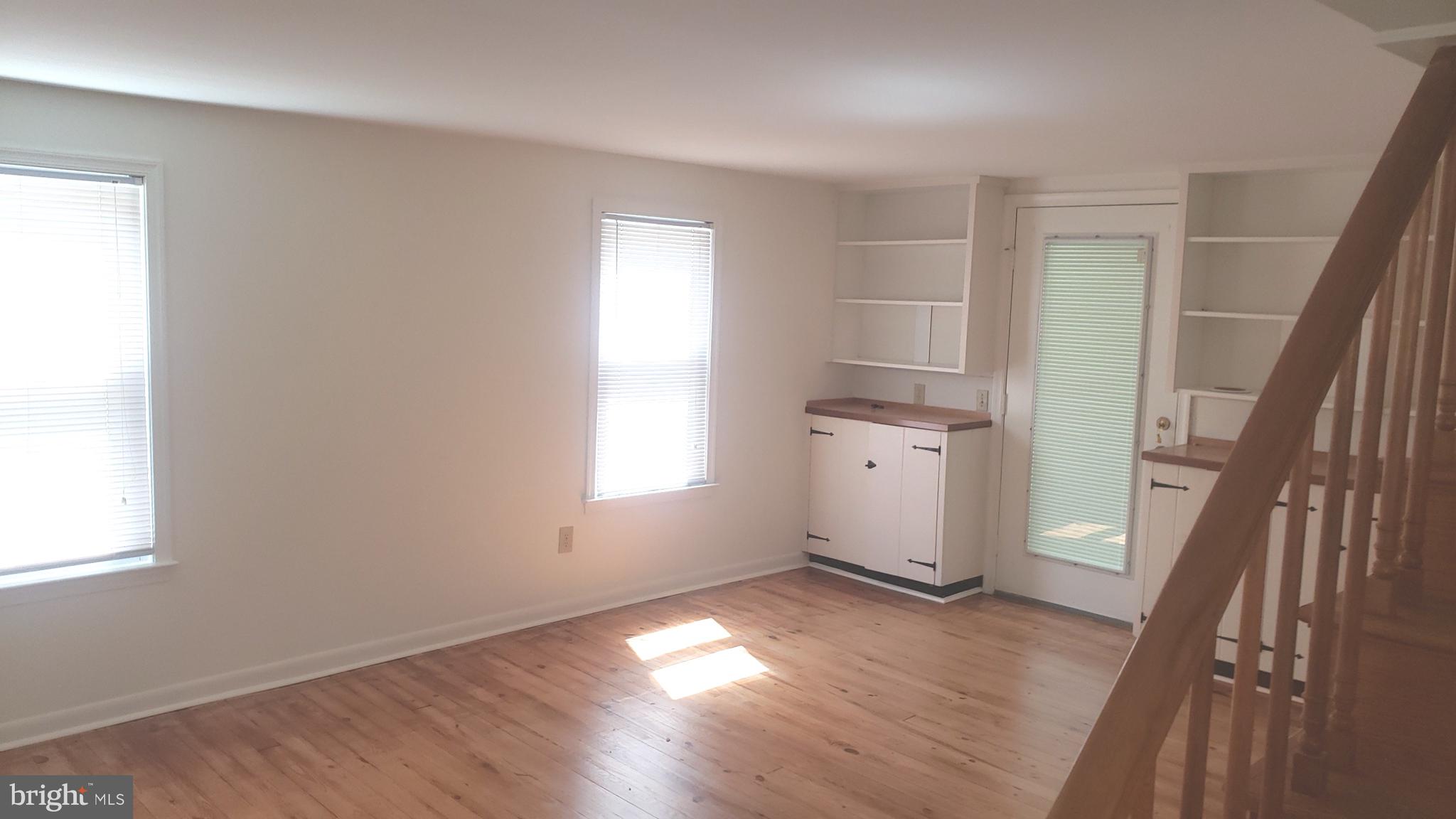 625 Southwood Road Hockessin, DE 19707 - Photo 14 of 16 an empty room with wooden floor and windows
