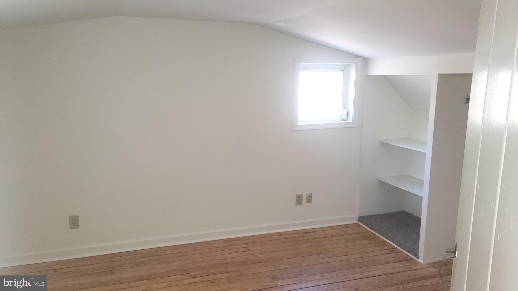 625 Southwood Road Hockessin, DE 19707 - Photo 15 of 16 a view of an empty room with wooden floor and a window
