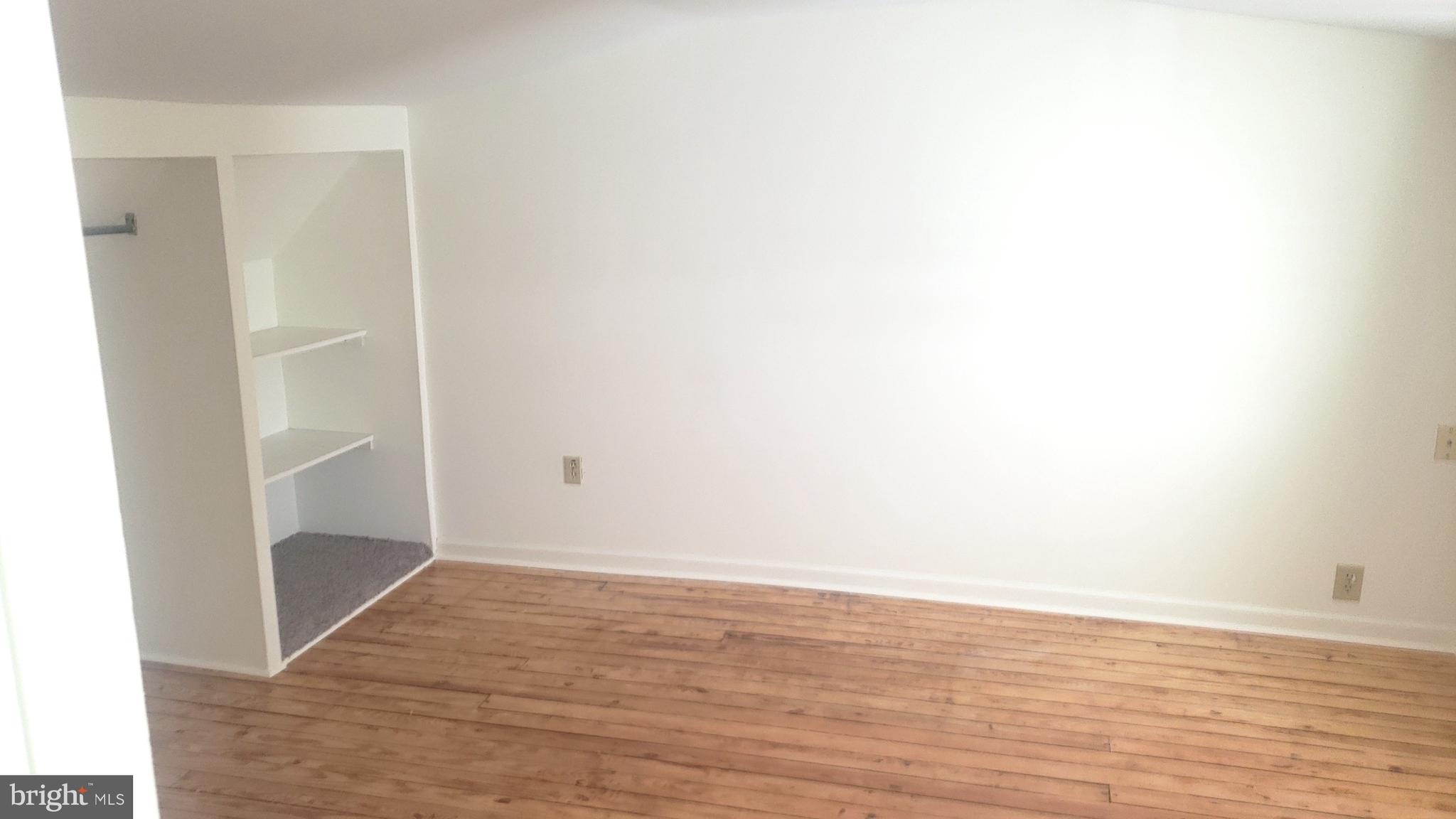 625 Southwood Road Hockessin, DE 19707 - Photo 16 of 16 a view of an empty walk in closet with wooden floor