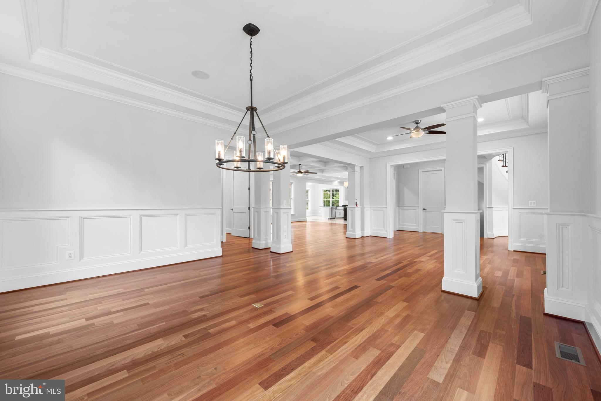 7003 Churchill Road McLean, VA 22101 - Photo 11 of 76 a view of a room with wooden floor staircase and a chandelier